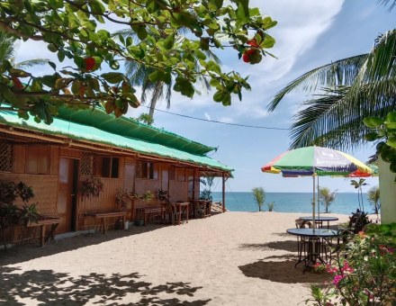 Beachfront cabanas at sunset